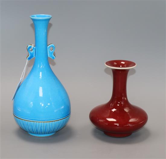 An Oriental sang de boeuf vase and a similar blue ground vase tallest 24cm